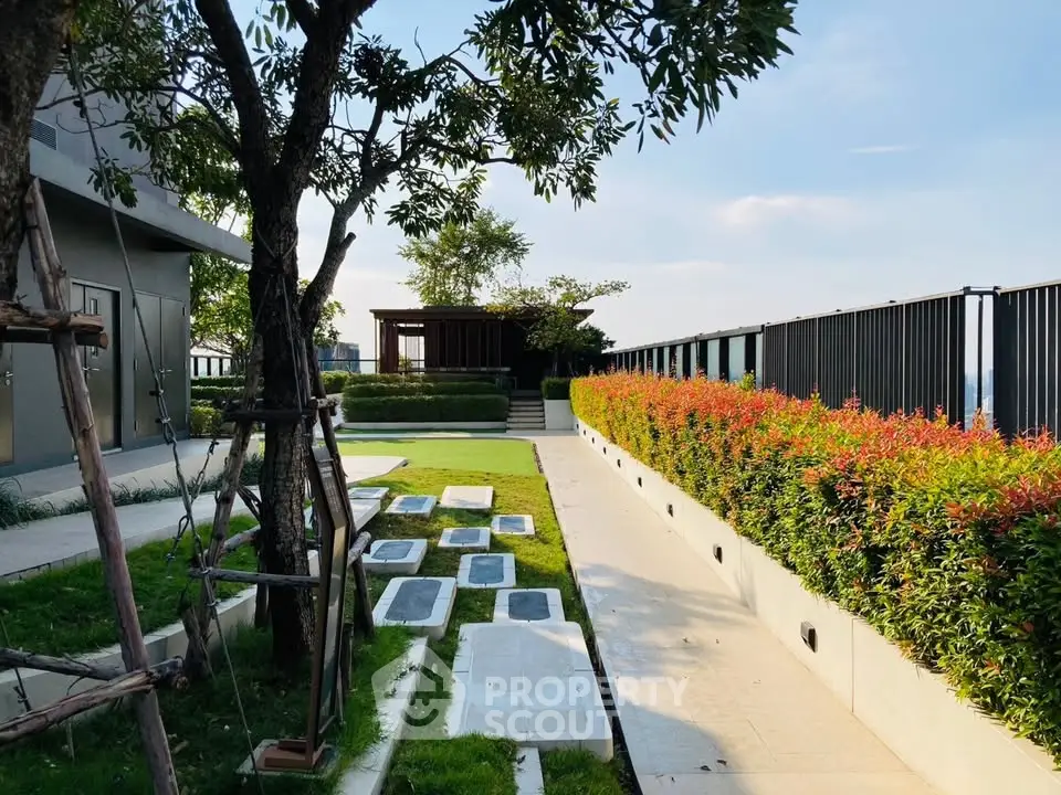 Luxurious rooftop garden with lush greenery and modern design, perfect for relaxation and city views.
