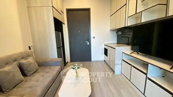 Modern compact living room with sleek kitchen and stylish decor