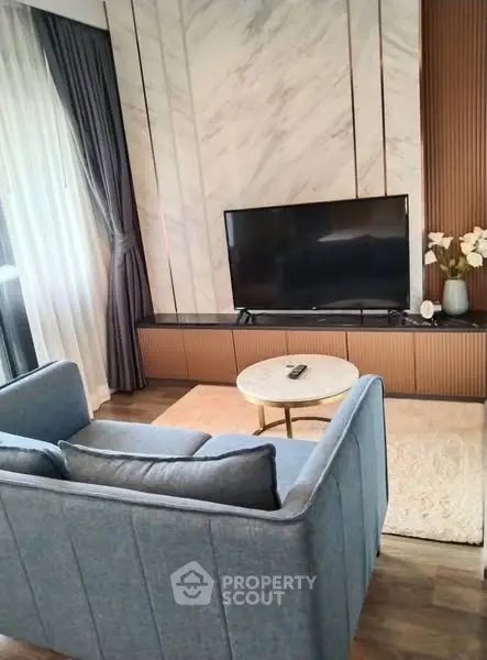 Stylish modern living room with elegant decor and large TV setup