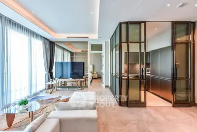Luxurious open-plan living room with modern decor and large windows