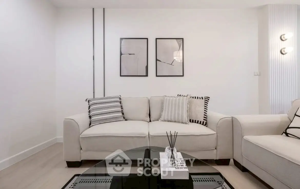 Modern living room with stylish decor and comfortable seating in a contemporary apartment.