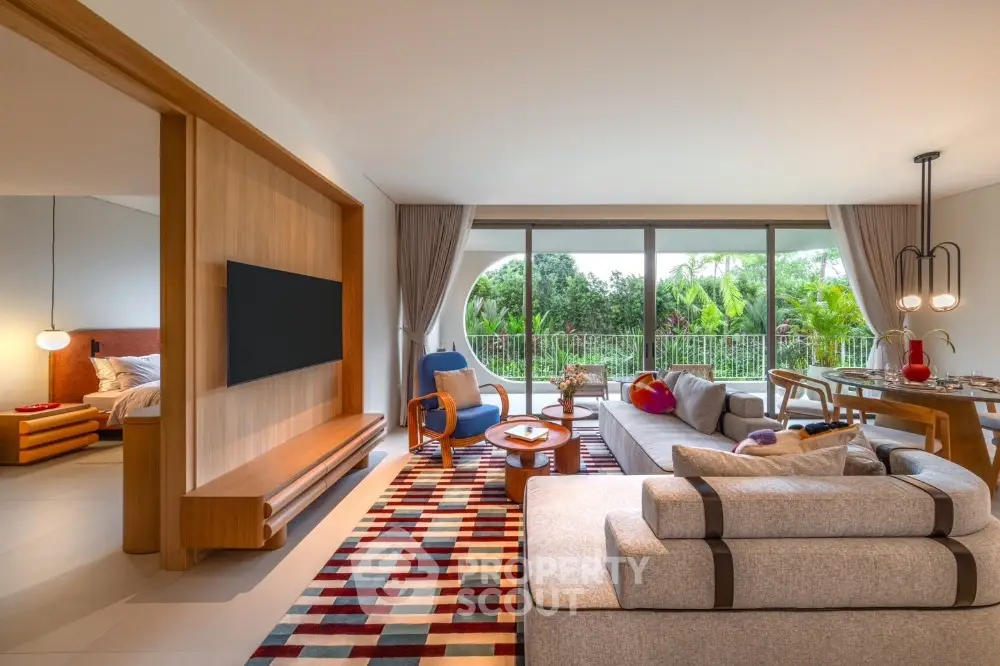 Spacious modern living room with large windows and garden view