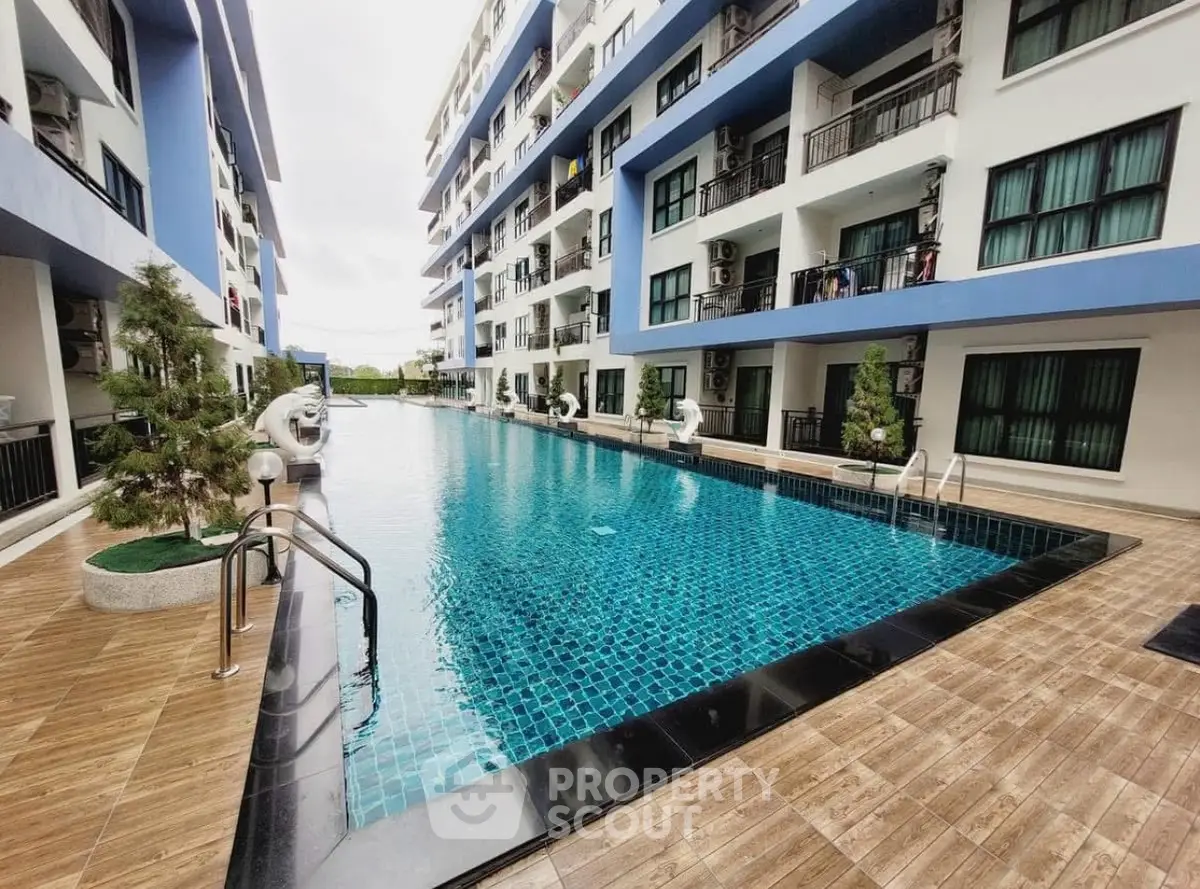 Luxurious condominium with stunning pool and modern architecture, perfect for relaxation and leisure.