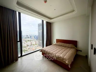 Luxurious bedroom with stunning city view in high-rise apartment