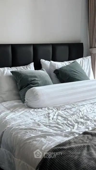 Luxurious bedroom with plush bedding and elegant decor