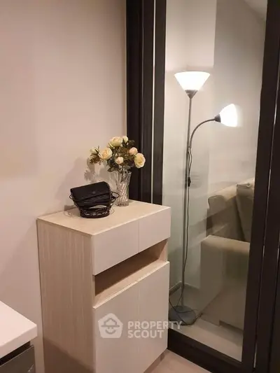 Cozy interior corner with modern furniture and elegant lighting