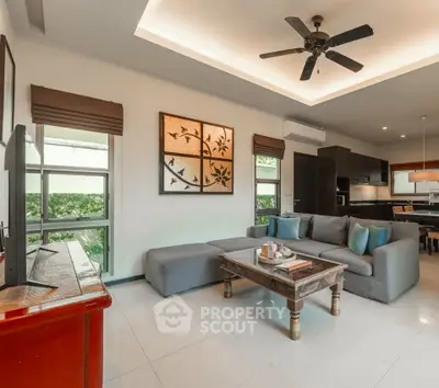 Spacious modern living room with elegant decor and open kitchen layout
