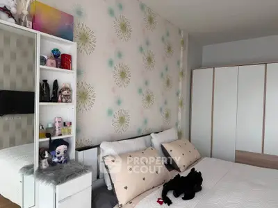 Charming bedroom with stylish decor and ample storage, perfect for a cozy retreat.