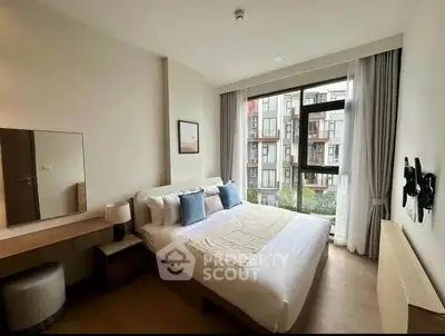 Modern bedroom with large window and stylish decor in urban apartment