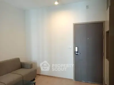 Modern living room with sleek sofa and secure door