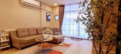 Stylish living room with modern decor and cozy seating area.