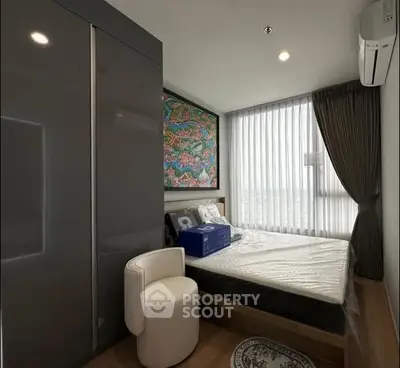 Modern bedroom with large window and stylish decor