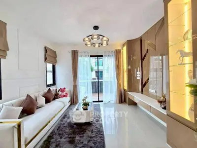 Luxurious modern living room with elegant decor and large windows for natural light.