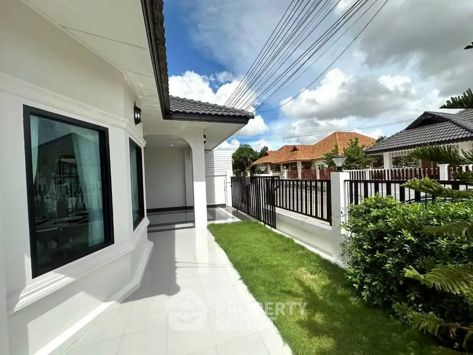 Charming single-story home with lush garden and modern exterior design in a serene neighborhood.