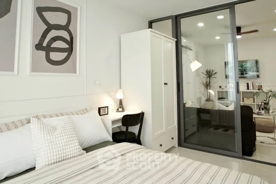 Modern bedroom with glass partition and stylish decor