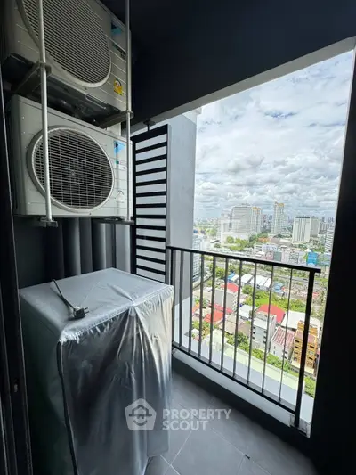 High-rise balcony with city view and air conditioning units, perfect for urban living.