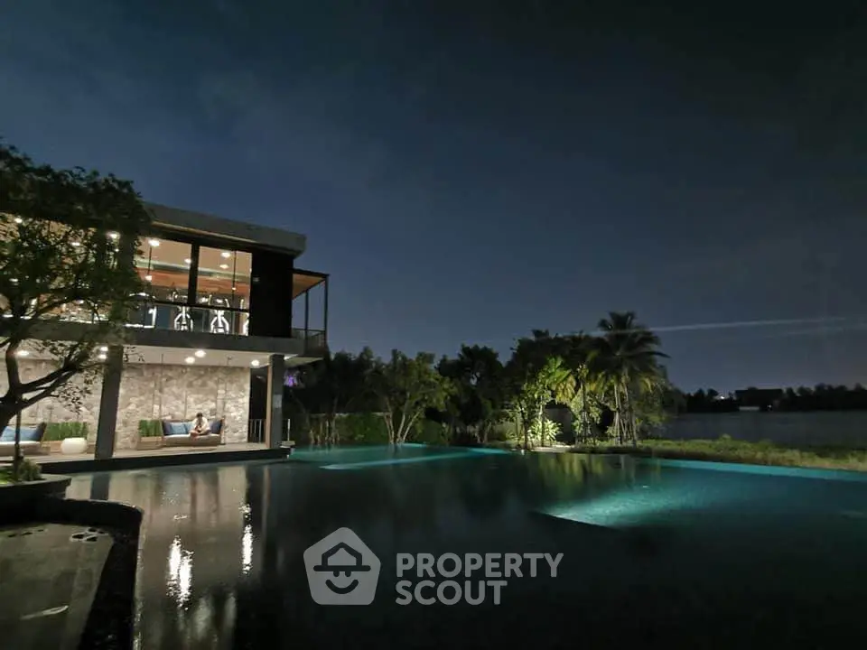 Luxurious modern villa with stunning pool and serene night view