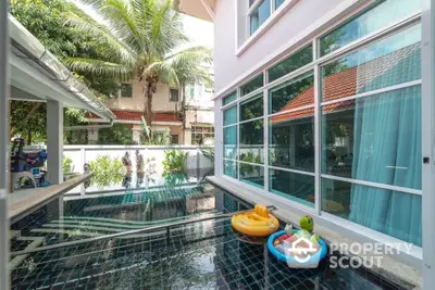 Stunning modern home with private pool and lush greenery, perfect for relaxation and entertainment.