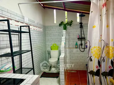 Charming bathroom with modern shower and stylish tile design.