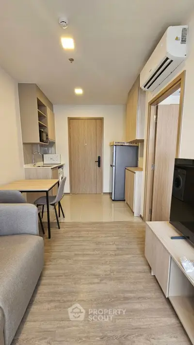 Modern apartment interior with open kitchen and cozy living area