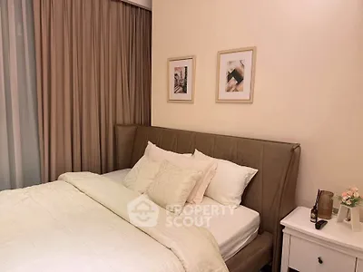 Cozy bedroom with elegant decor and soft lighting, perfect for relaxation.