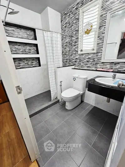 Modern bathroom with stylish tile design and sleek fixtures