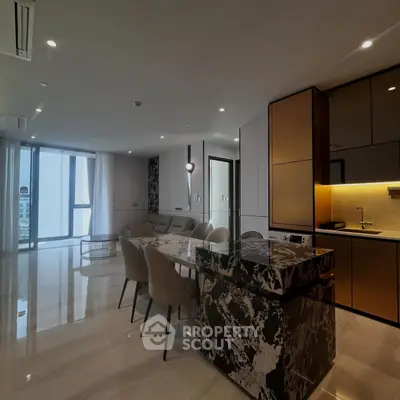Luxurious open-plan living room with modern kitchen and marble island in high-rise apartment.