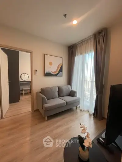 Modern living room with cozy sofa and elegant decor in a bright apartment.