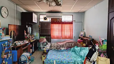 Cozy bedroom with colorful decor and ample storage space
