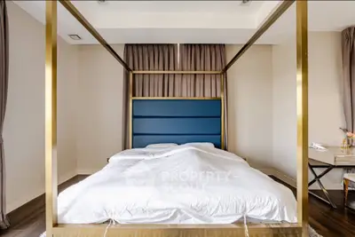 Luxurious bedroom with elegant four-poster bed and modern decor