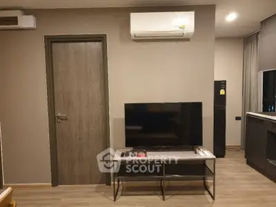 Modern living room with air conditioning and flat-screen TV