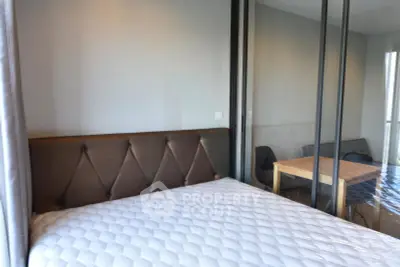 Modern bedroom with glass partition and cozy dining area