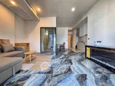 Spacious modern living room with stylish flooring and open kitchen layout