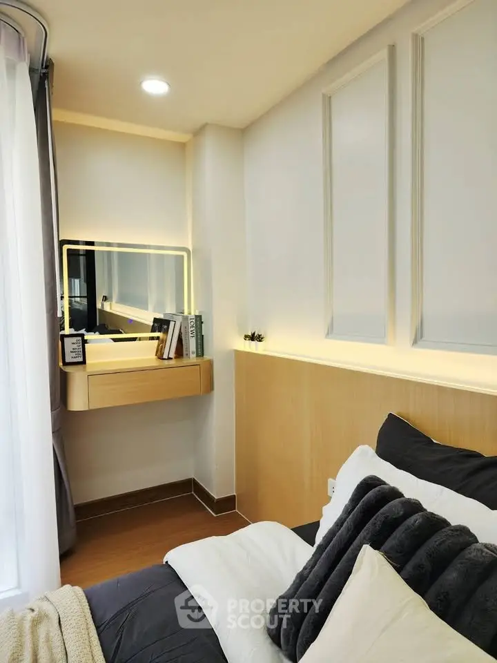 Cozy modern bedroom with stylish decor and built-in vanity area