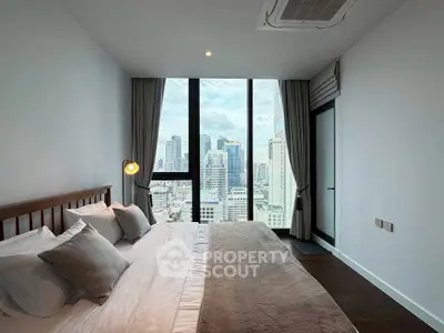 Luxurious bedroom with stunning city view and modern decor
