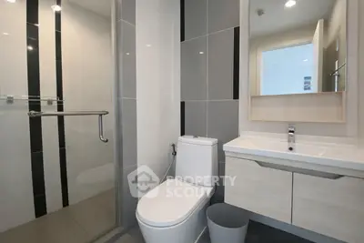 Modern bathroom with sleek design and glass shower enclosure