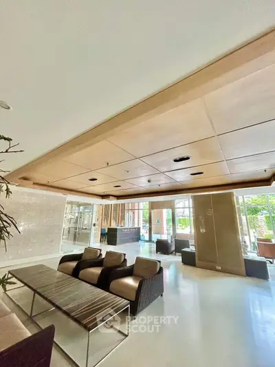 Spacious modern living room with elegant seating and natural light