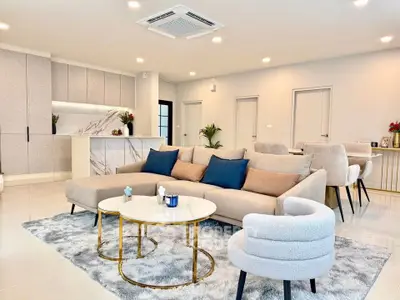 Spacious modern living room with open kitchen and elegant decor