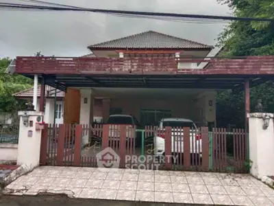 Charming suburban house with spacious carport and tiled driveway, perfect for family living.