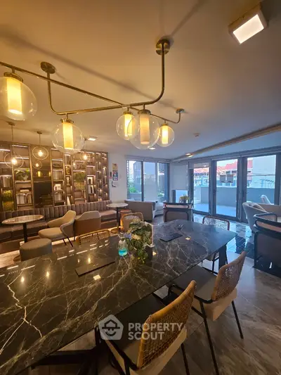 Luxurious modern living room with elegant lighting and spacious balcony view