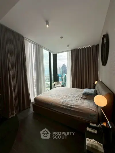 Luxurious bedroom with stunning city view and modern decor