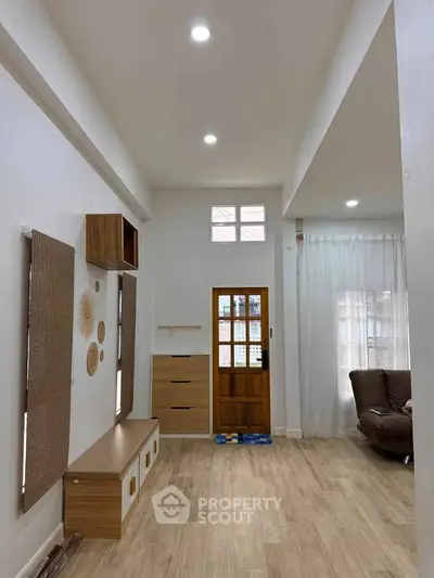 Spacious living room with modern decor and natural light