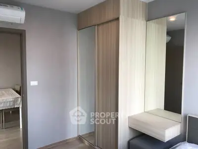Modern bedroom with sleek built-in wardrobe and minimalist design