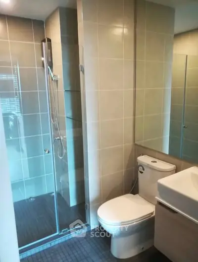 Modern bathroom with glass shower and sleek fixtures