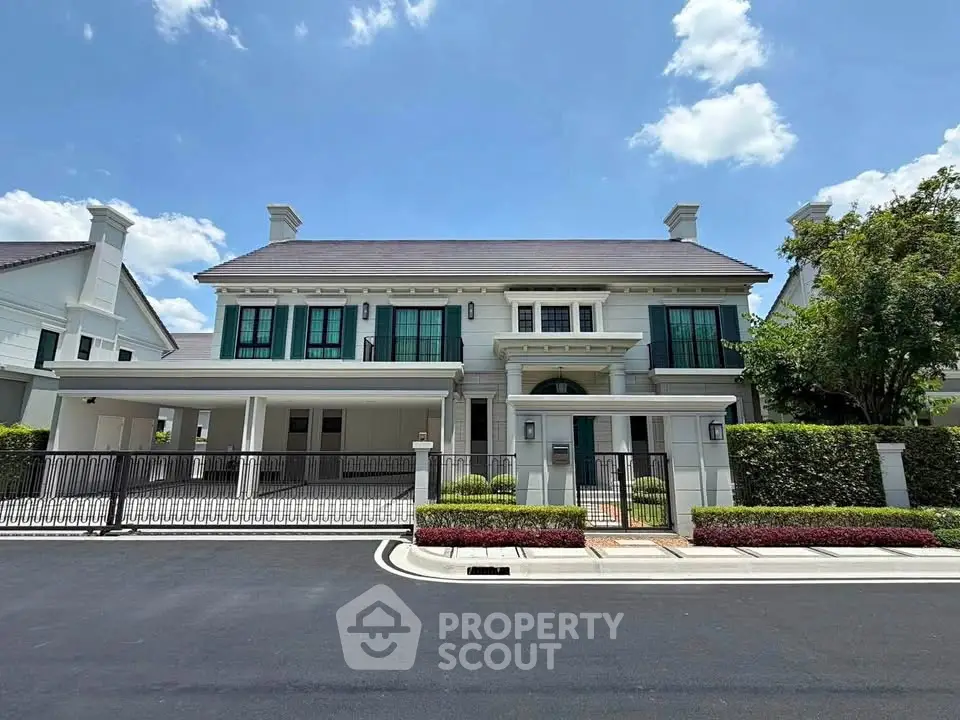 Stunning two-story luxury home with elegant facade and spacious driveway in a serene neighborhood.