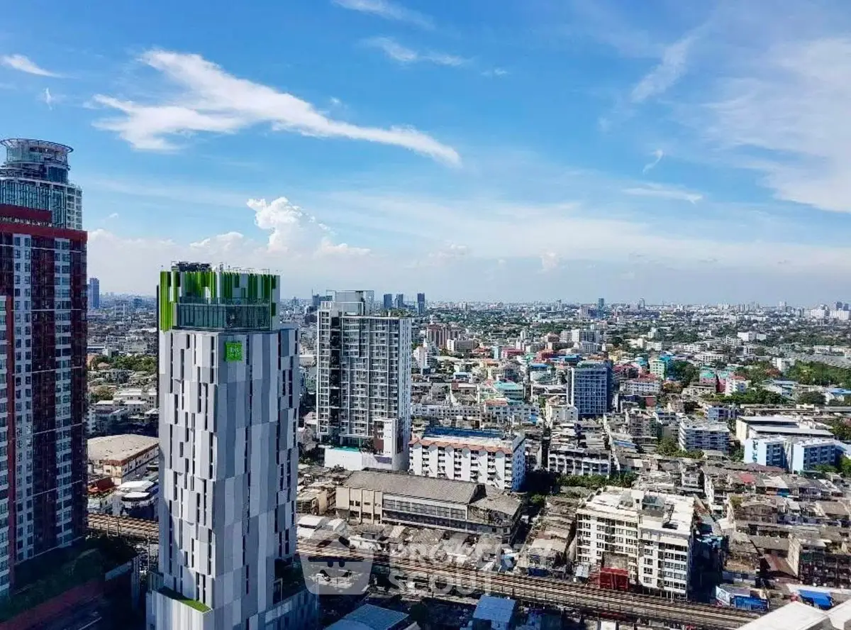 Stunning cityscape view showcasing modern high-rise buildings under a clear blue sky.