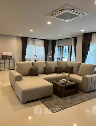 Spacious modern living room with plush sectional sofa and elegant decor