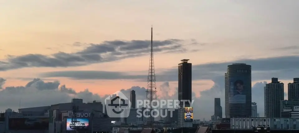 Stunning city skyline view with modern skyscrapers at sunset, perfect for urban living enthusiasts.