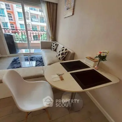 Chic living room with modern decor and balcony view in urban apartment