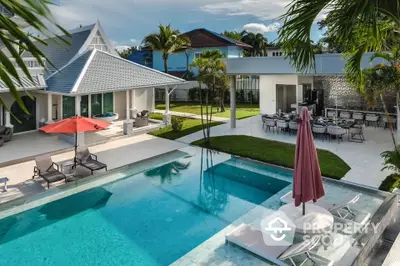 Luxurious tropical villa with private pool and spacious outdoor area for relaxation.